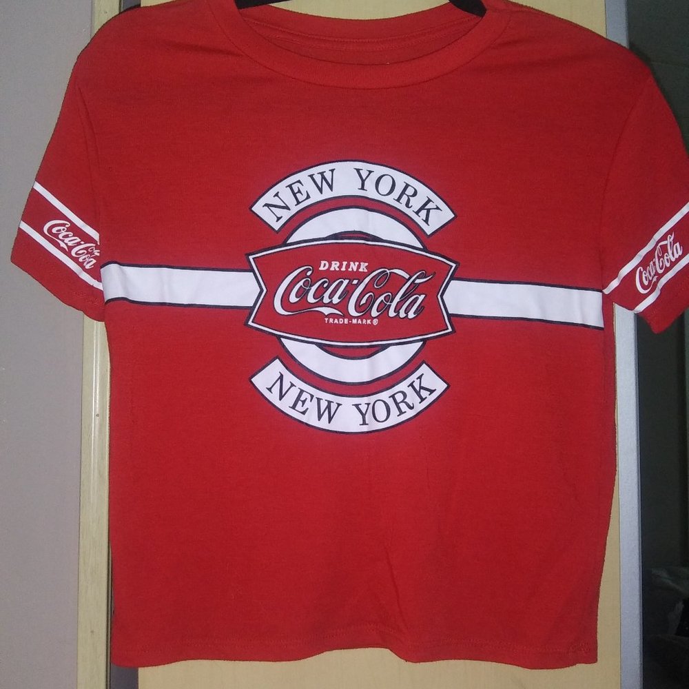 a red coca cola shirt